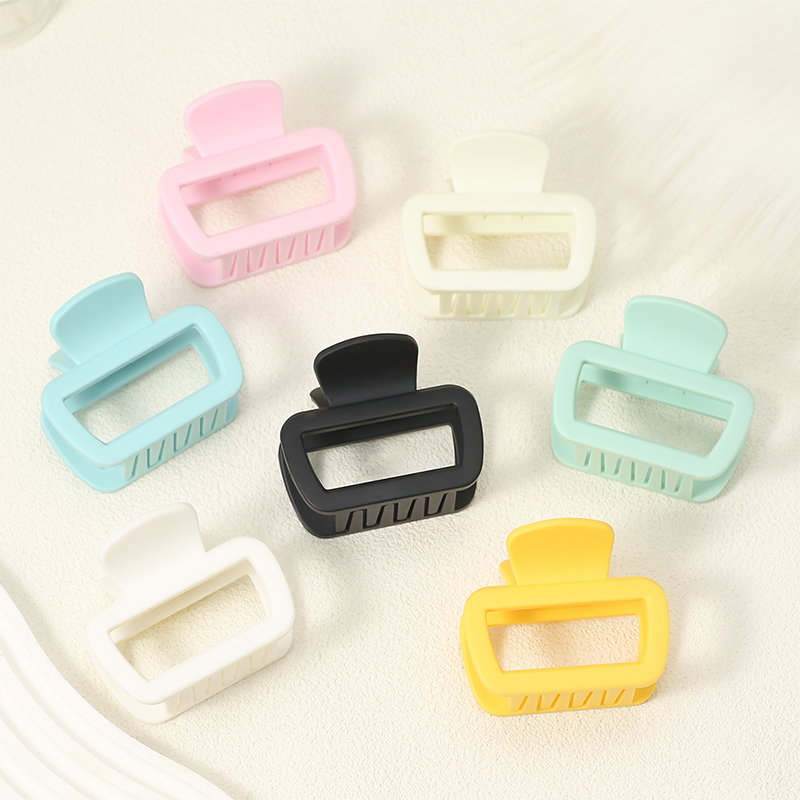 Clip de pinza para el cabello de plástico con inyección trapezoidal redondeada