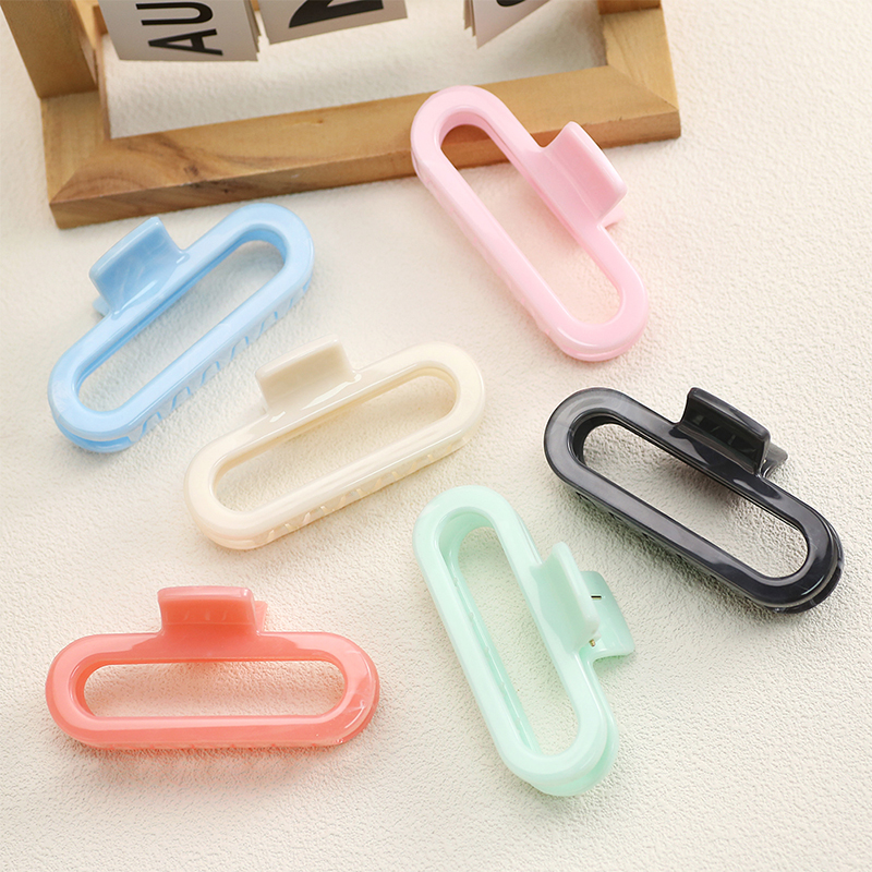 Clip ovalado de plástico para garras de cabello inyectado