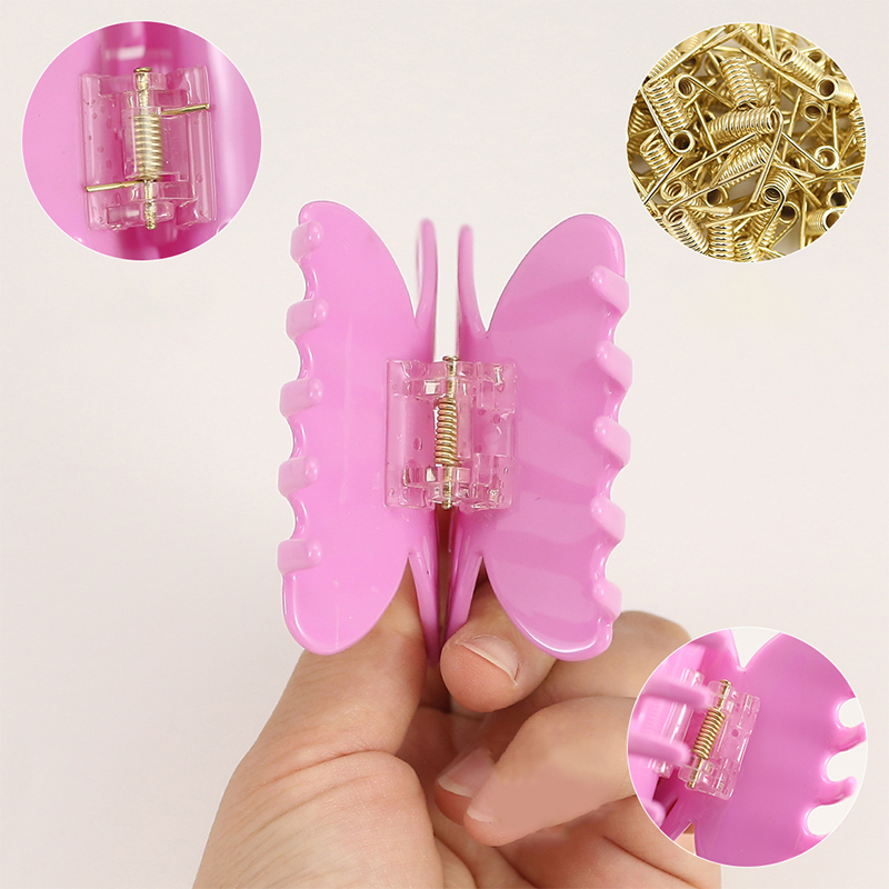 Pinza para el cabello con acetato y alas de mariposa grandes