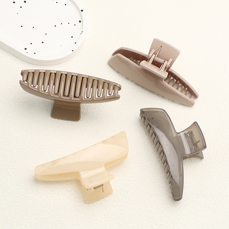 Pequeña pinza de plástico para el cabello con inyección basculante de una línea